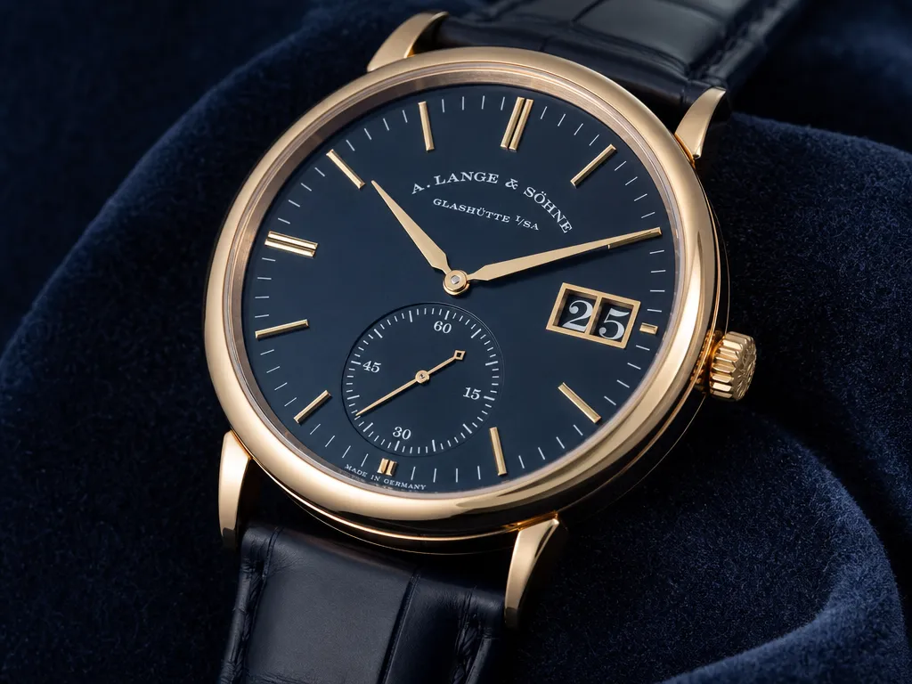 Macro close-up of a watch on a dark navy velvet surface, sharp focus on the dial and indices, soft falloff into the strap, luxury editorial product photography